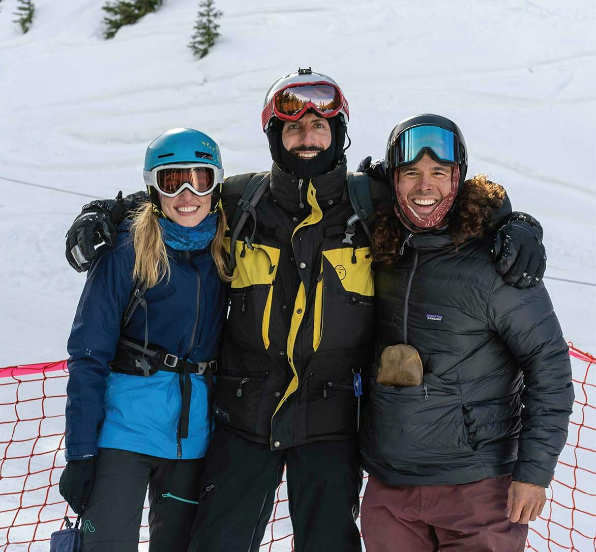 Three Curated employees taking a photo in ski gear